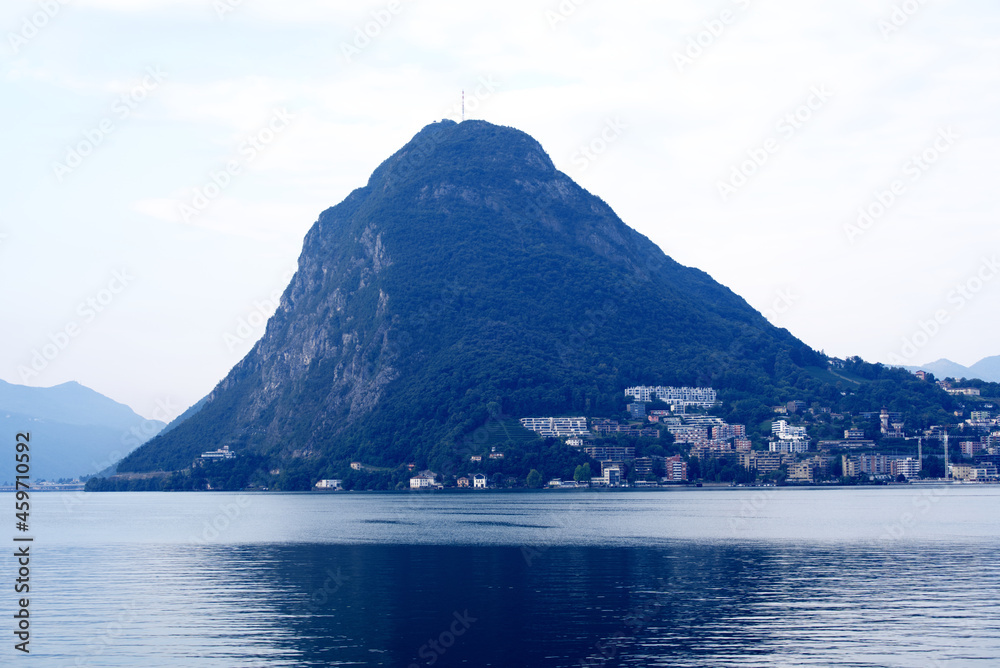 Mountain San Salvatore at Lake Lugano on a sunny late summer morning. Photo taken September 11th, 2021, Lugano, Switzerland.