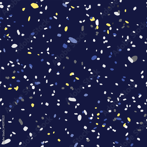 Abstract seamless pattern with colorful dots, speckles on dark blue background. Night sky with stars. Ink splash spots splatter spray vector texture. Simple cute design for fabric print, wallpaper.