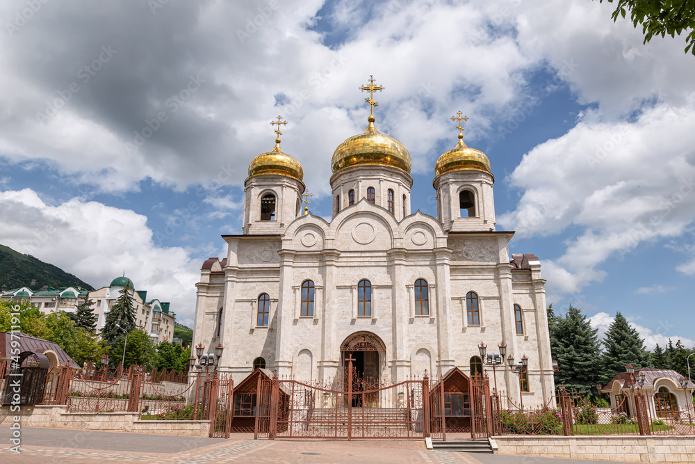 Large Orthodox church with white-stone facade and gilded domes