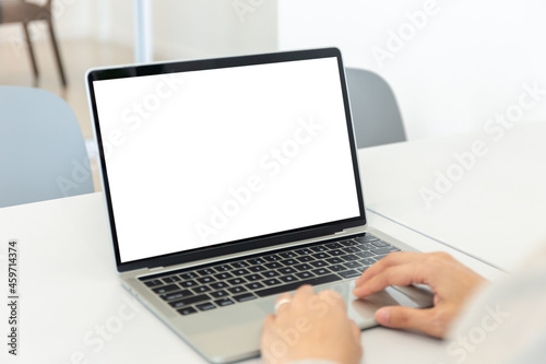 computer screen blank mockup.hand woman work using laptop with white background for advertising,contact business search information on desk at coffee shop.marketing and creative design