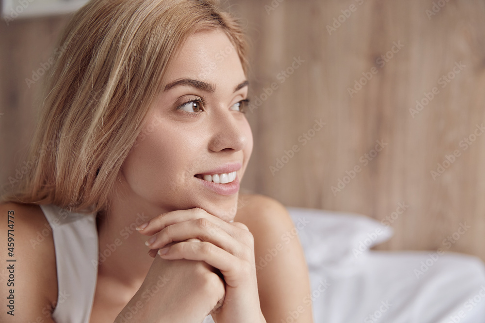 European woman laying and resting on bed at home European woman laying and resting on bed at home