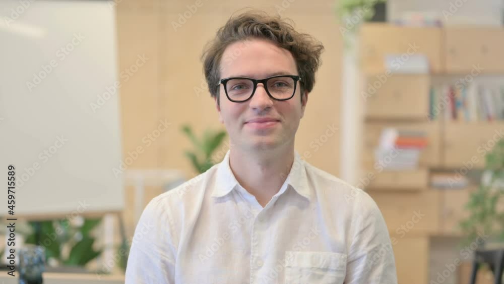 Portrait of Young Man Shaking Head as Yes Sign, Approval