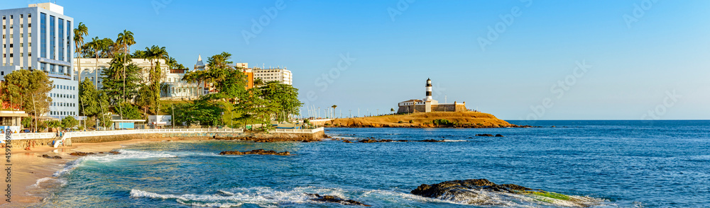 Panoramic image during the afternoon of the Barra lighthouse, beach and buildings in the city of Salvador in Bahia