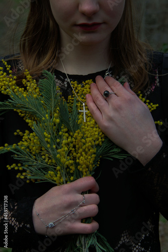 woman holding a flower