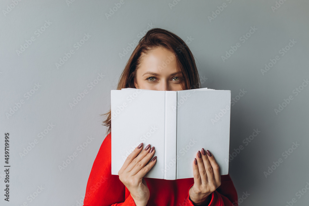 Woman hands with book on isolated background. Education, smart woman concept Woman hands with book on isolated background. Education, smart woman concept