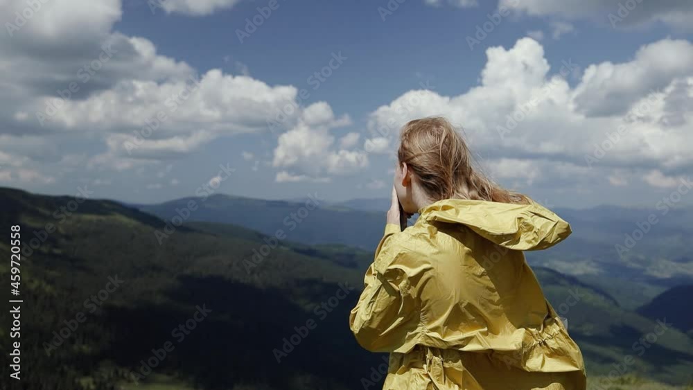 Professional photographer traveler with camera taking photo of mountains standing on top of a mountain and enjoying. Amazing view trip adventure. Carpathians, Ukraine, Europe. Professional photographer traveler with camera taking photo of mountains standing on top of a mountain and enjoying. Amazing view trip adventure. Carpathians, Ukraine, Europe.