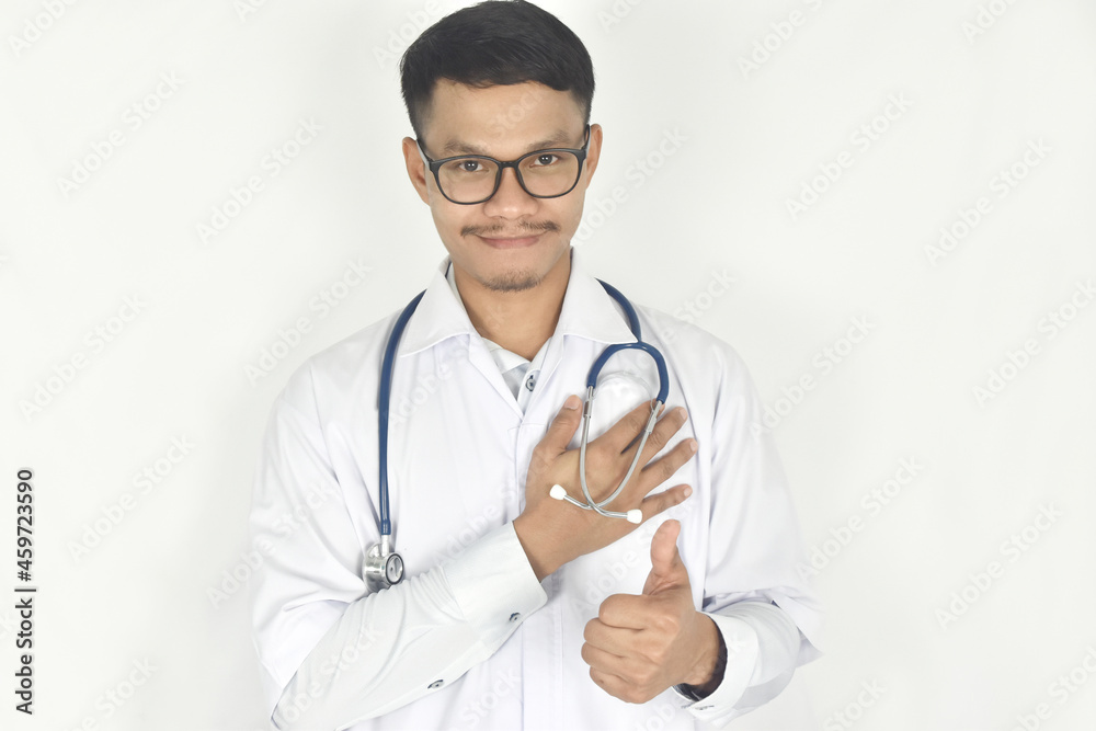 Portrait of doctor with hand touching heart and showing thumb up on white background. Portrait of doctor with hand touching heart and showing thumb up on white background.