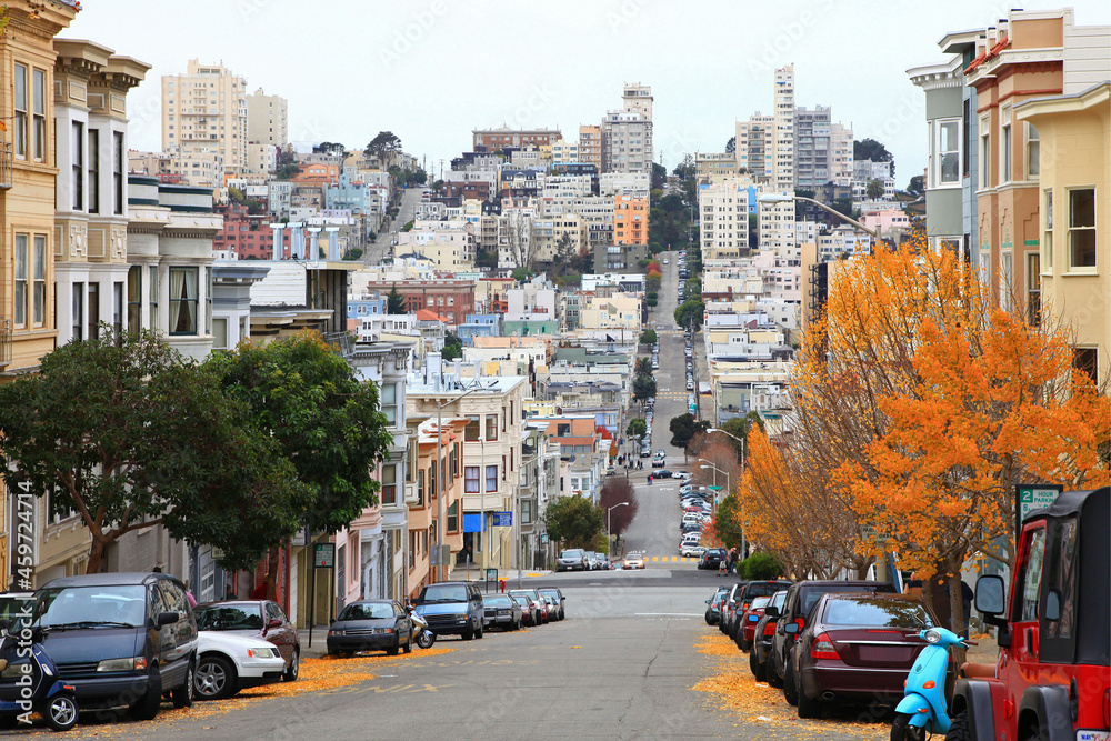 Historic residential buildings on Greenwich Street at Grant Avenue with Russian Hill at the background, city of San Francisco, California CA, USA. 