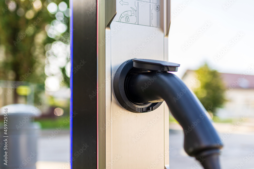 Socket for electrical car battery charger with load indicator lights, selective focus,outdoors shot.Closeup. Socket for electrical car battery charger with load indicator lights, selective focus,outdoors shot.Closeup.