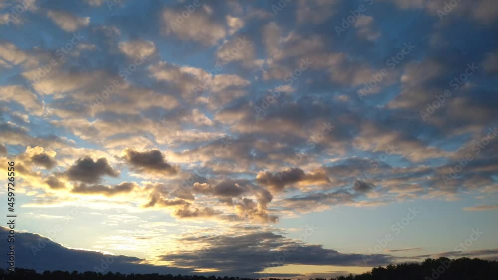 The sun's rays make their way through thunderclouds. Sunset. B roll. time lapse The sun's rays make their way through thunderclouds. Sunset. B roll. time lapse