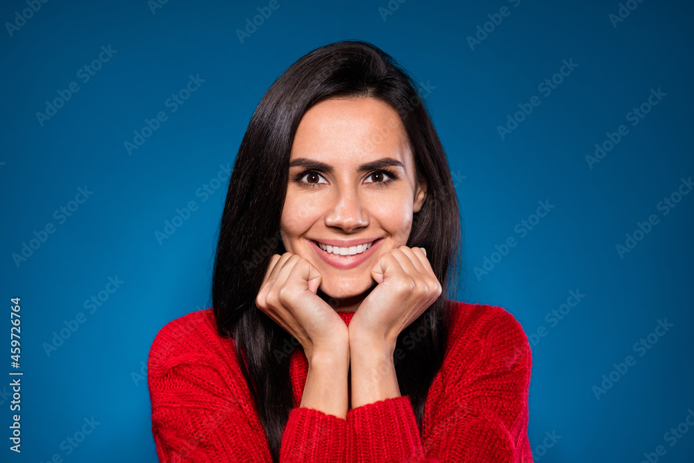 Photo of positive pretty brown hair lady hands cheeks wear red sweater isolated on blue color background