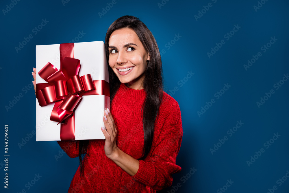 Photo portrait of girl smiling guess what in present box looking copyspace isolated on gradient blue color background Photo portrait of girl smiling guess what in present box looking copyspace isolated on gradient blue color background