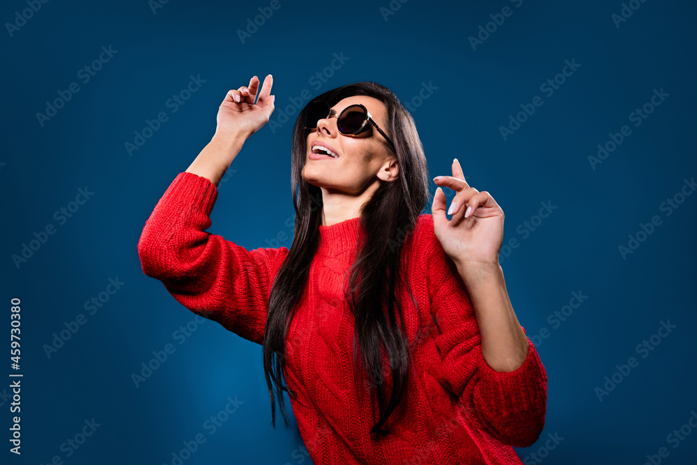Photo portrait of girl smiling wearing sunglass dancing at party overjoyed isolated on gradient blue color background Photo portrait of girl smiling wearing sunglass dancing at party overjoyed isolated on gradient blue color background