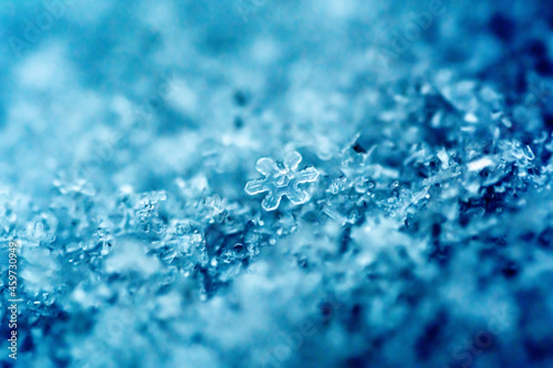 Extreme macro photo of a snowflake. Natural snow texture. Macro texture of snow, snowflakes.