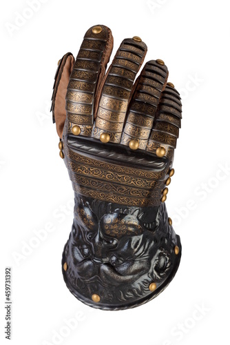 Medieval knightly brown plate gauntlet from Italian armor, in the form of a lion's face and mane, period of the 16th century, on a light background. photo