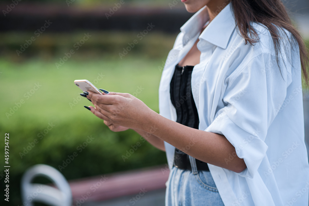 Close up of female hands using a smartphone. Close up of female hands using a smartphone.
