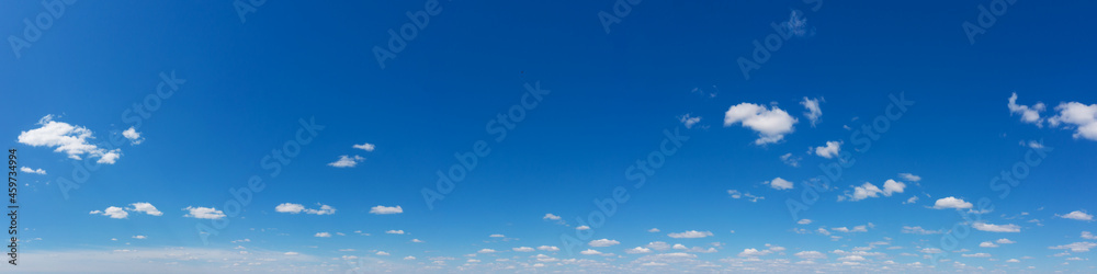 Fototapeta premium Blue Sky background with tiny Clouds. Panorama background