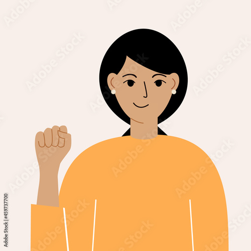 The concept of female power and the feminist international movement. A woman with a raised fist.