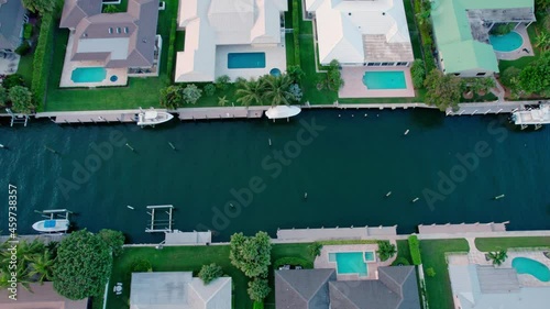 Aerial flight over beautiful homes on a Florida canal