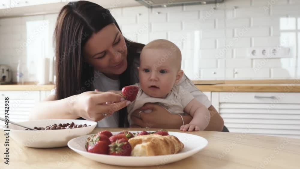 little child wants to try strawberries for the first time little child wants to try strawberries for the first time