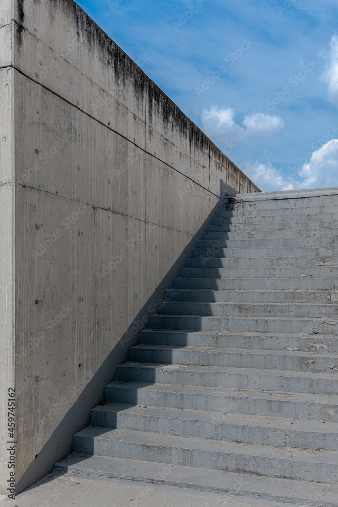 Staircase and wall of a concrete building outdoors without people. 