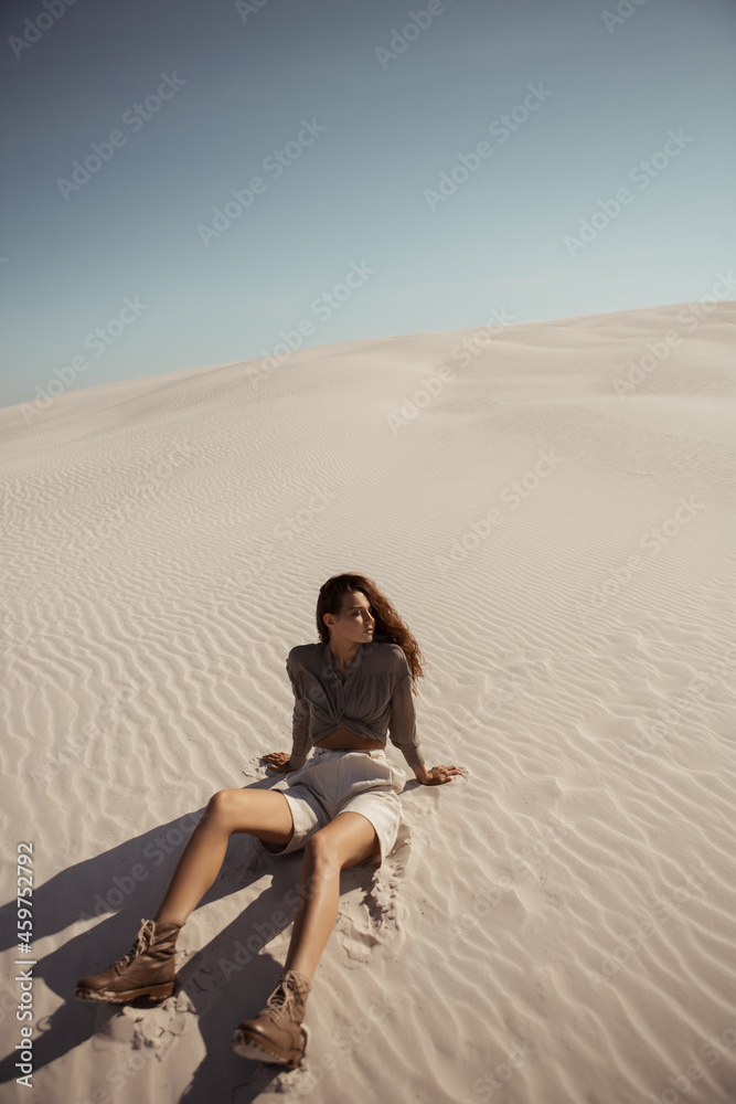 Safari Woman in Desert Outdoors, Dunes on the Background Safari Woman in Desert Outdoors, Dunes on the Background