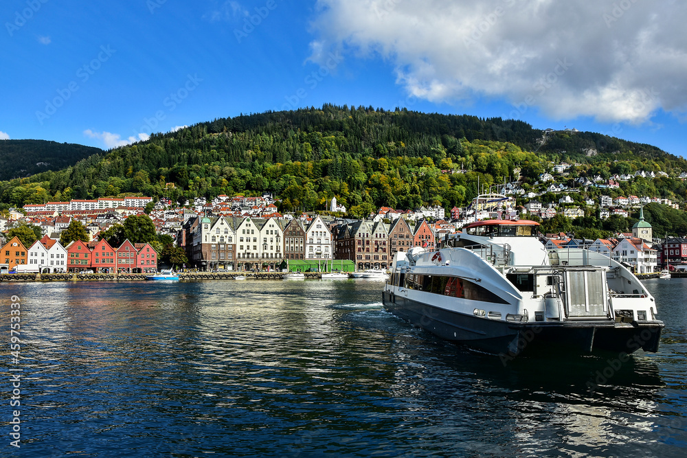 ship and typical old buildings in Bryggen district in Bergen, a beautiful city in Norway ship and typical old buildings in Bryggen district in Bergen, a beautiful city in Norway