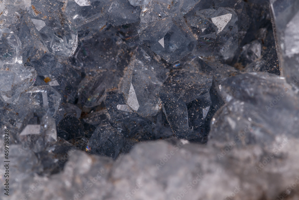 Celestine mineral stone macro on microcline on black background
