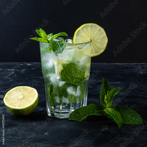 Refreshing summer alcoholic cocktail mojito with ice, fresh mint and lime