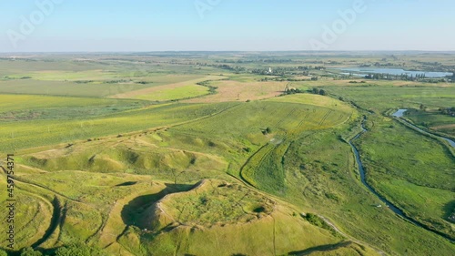 A large bulk mountain among the green field