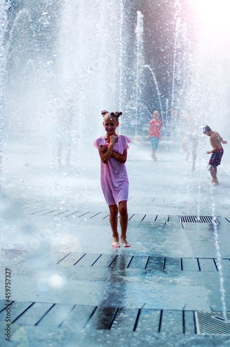 Girl and dry fountain. Childhood. Running on water. Emotions.