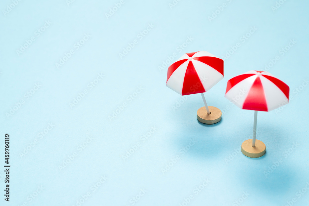Fototapeta premium Red umbrella on a blue background.