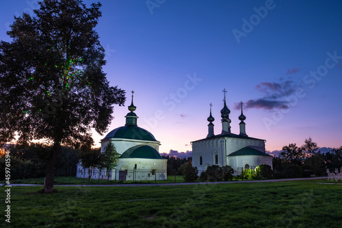 Reliefs of the domes of the Pyatnitskaya and the Entrance-Hierasalimskaya churches in the city of Suzdal against the background of the evening sky. photo