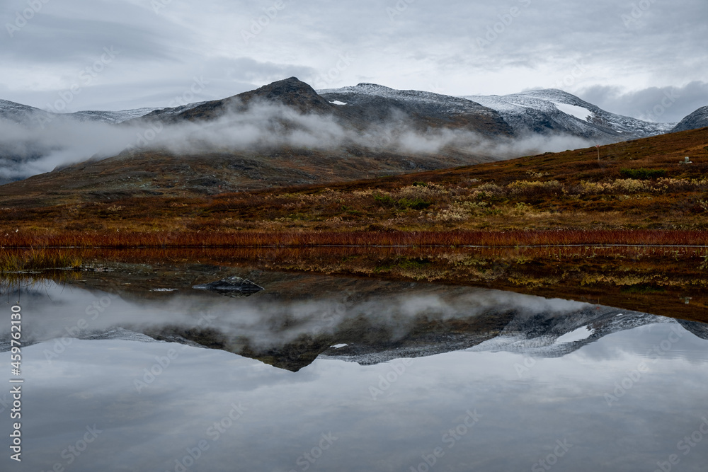 Mountain reflection in water with clouds in Hemavan