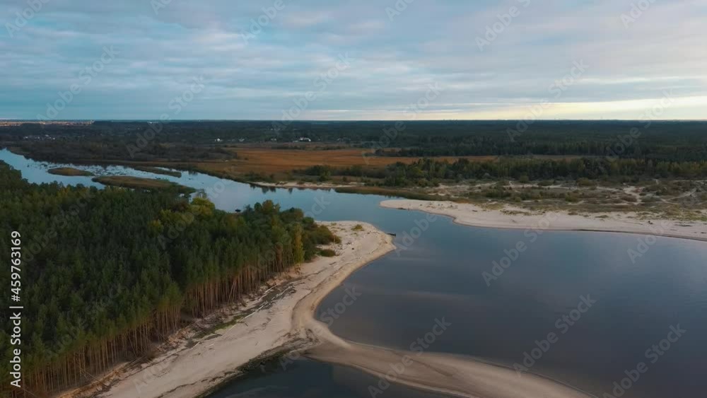 The Gauja River Flows Into the Baltic Sea Gulf of Riga. Broken Pines After Storm and Washed Up Shore. Aerial Drone Top View Autumn Evening at Sunrise River Drain Into the Sea
