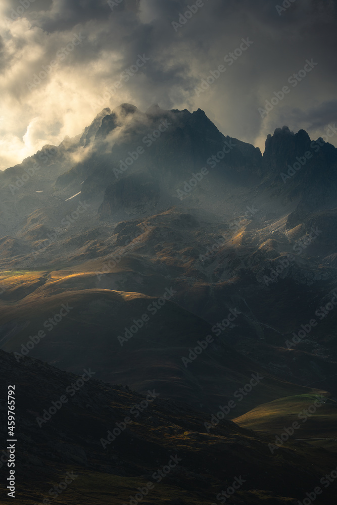 Beautiful dramatic light behind and on the mountains of the French Alps.