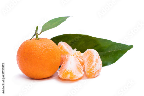 mandarin orange with green leaf isolated on white