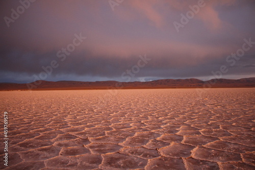 storm at salt flat desert on sunset