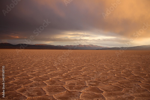 storm at salt flat desert on sunset