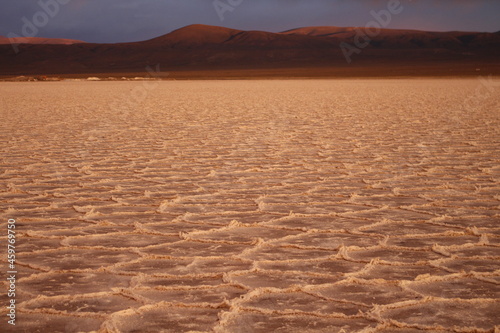 storm at salt flat desert on sunset