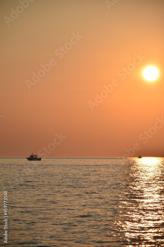 Boat trolling Lake Michigan at sunset © Verbbaitum