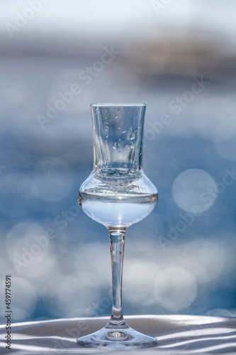 Greek classics alcohol glass with sea as background