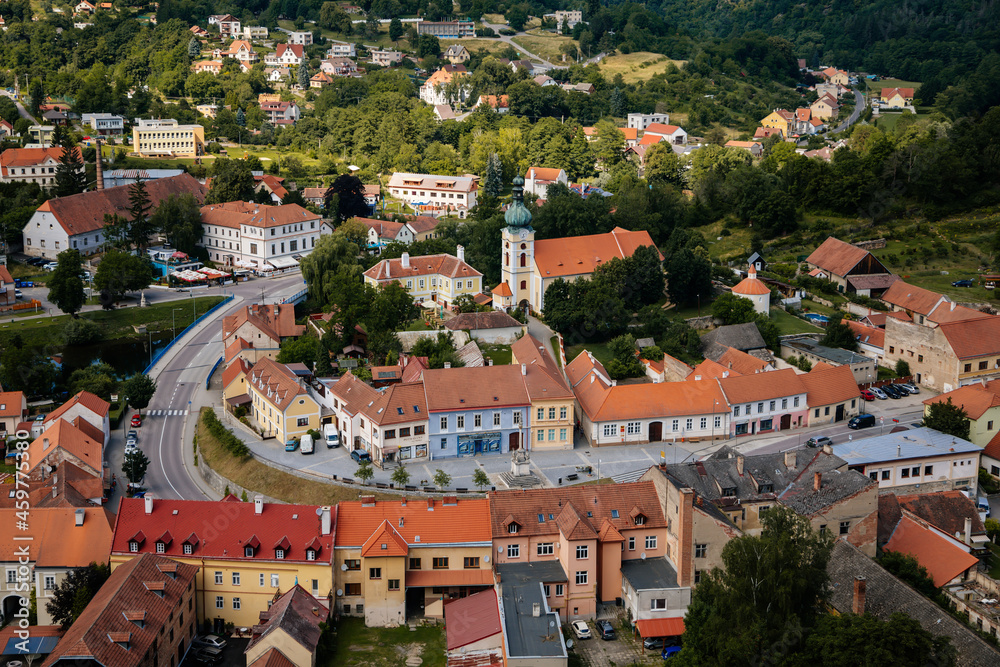 Fototapeta premium Vranov nad dyji, Southern Moravia, Czech Republic, 03 July 2021: medieval town on river bank, Narrow picturesque street with gothic, renaissance and baroque historical buildings at summer sunny day