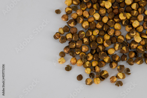 Selective focused Indian health snack roasted chickpeas with salt on an isolated white background. Cooked without oil and very healthy daily snacks, Tamilnadu, Mumbai, Delhi, Kerala.