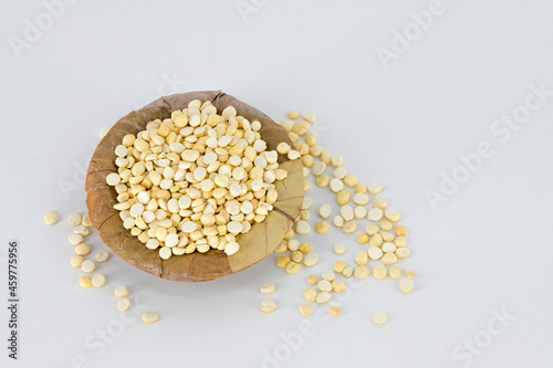 Selective focused Indian crispy salted fried and roasted Bengal gram or channa dal. Also called pori kadalai , pottu kadalai on isolated white background very healthy daily snacks