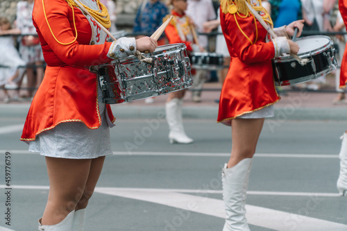 Young girls drummer at the parade. Street performance. Majorettes in the parade