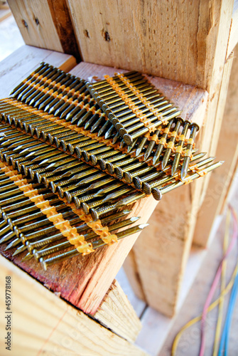 Collated nail strips for pneumatic nail gun close-up photo