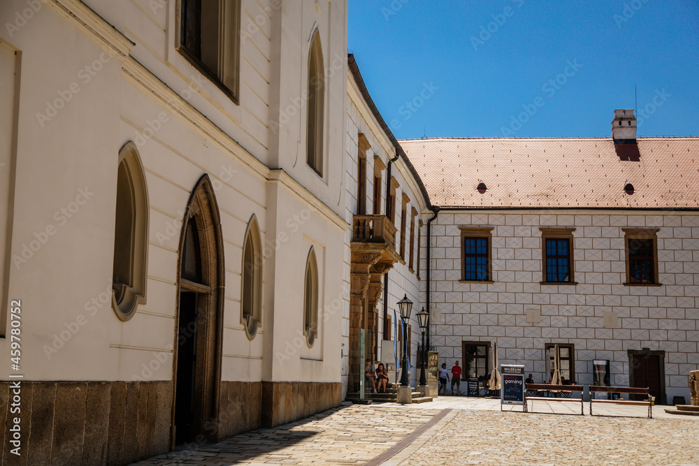Trebic, Bohemia, Czech Republic, 06 July 2021: medieval castle with museum in historic center, St. Procopius basilica and monastery Romanesque Gothic style, Benedictine herb garden, sunny summer day