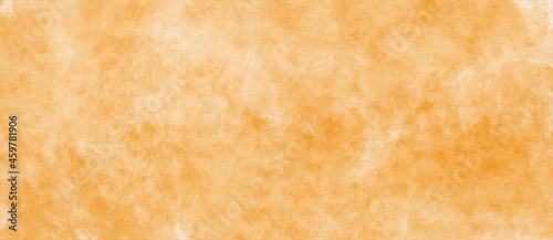 Orange background with grunge texture. Fall and  autumn colors design. Aged vintage texture in warm orange color. Halloween or Thanksgiving Day paper or banner, flyer, poster, brochure, postcard.
