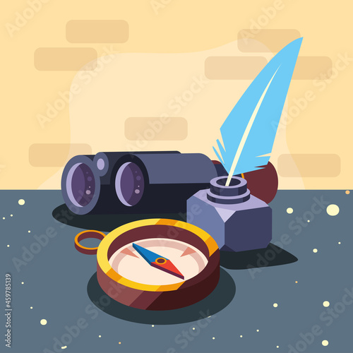 compass binoculars and feather pen